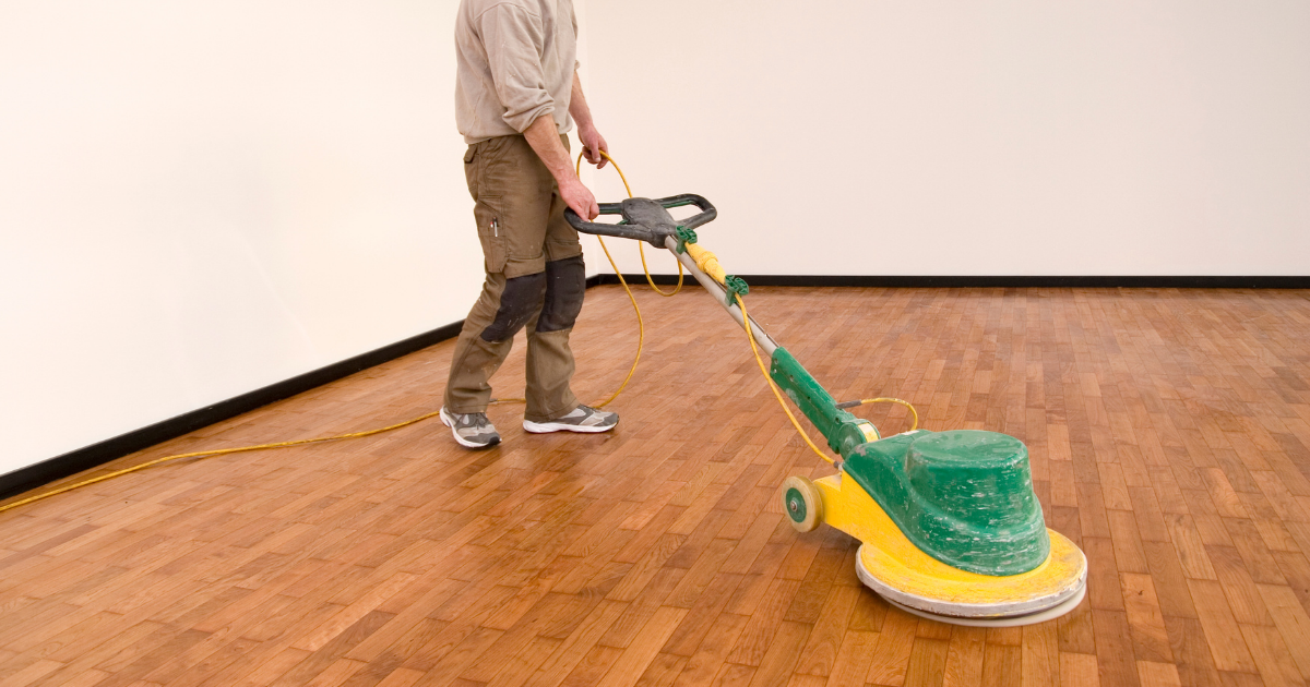 man finishing hardwood flooring man finishing hardwood flooring