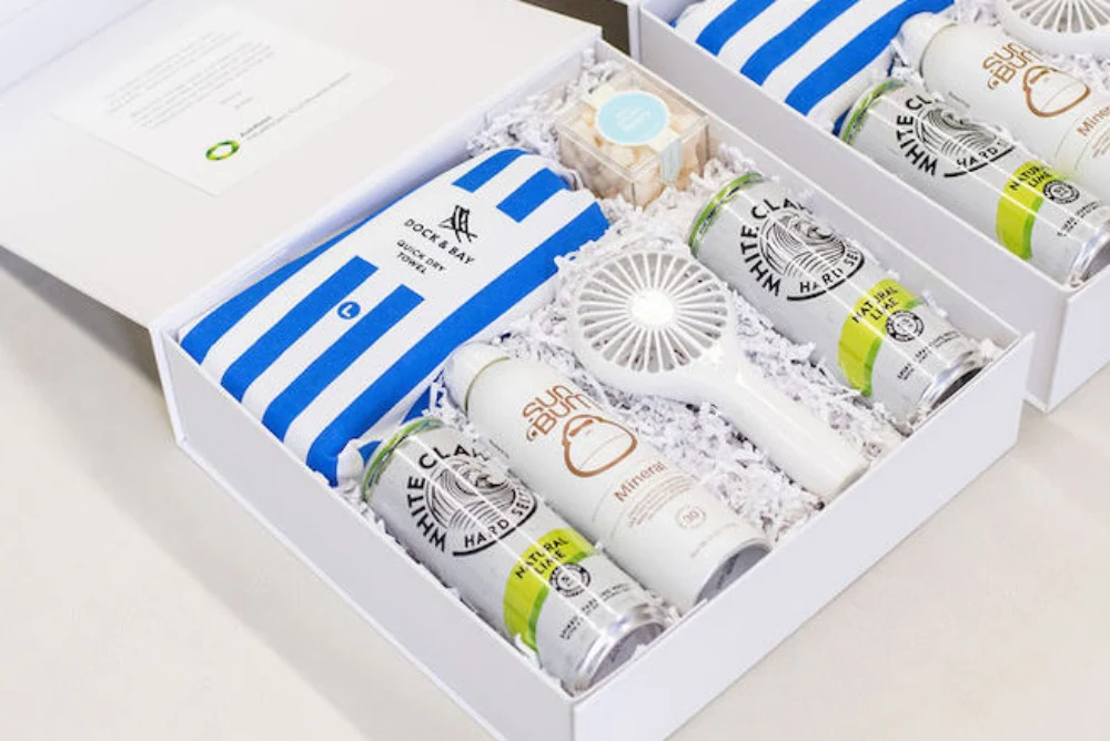 Gift box with handwritten note thanking client for a real estate referral.