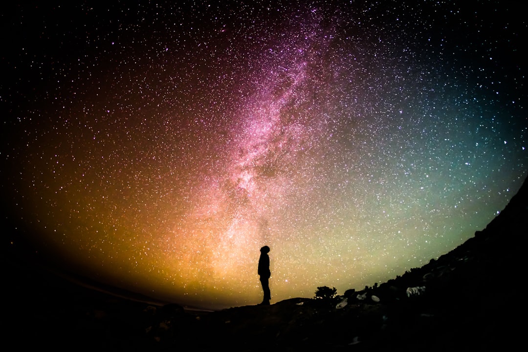 Person walking in front of the stars Person walking in front of the stars