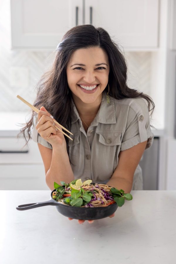 Image of Chloe Stein with chopsticks and bowl of vegetables Image of Chloe Stein with chopsticks and bowl of vegetables