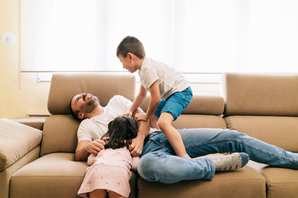 dad playing with children on the sofa dad playing with children on the sofa