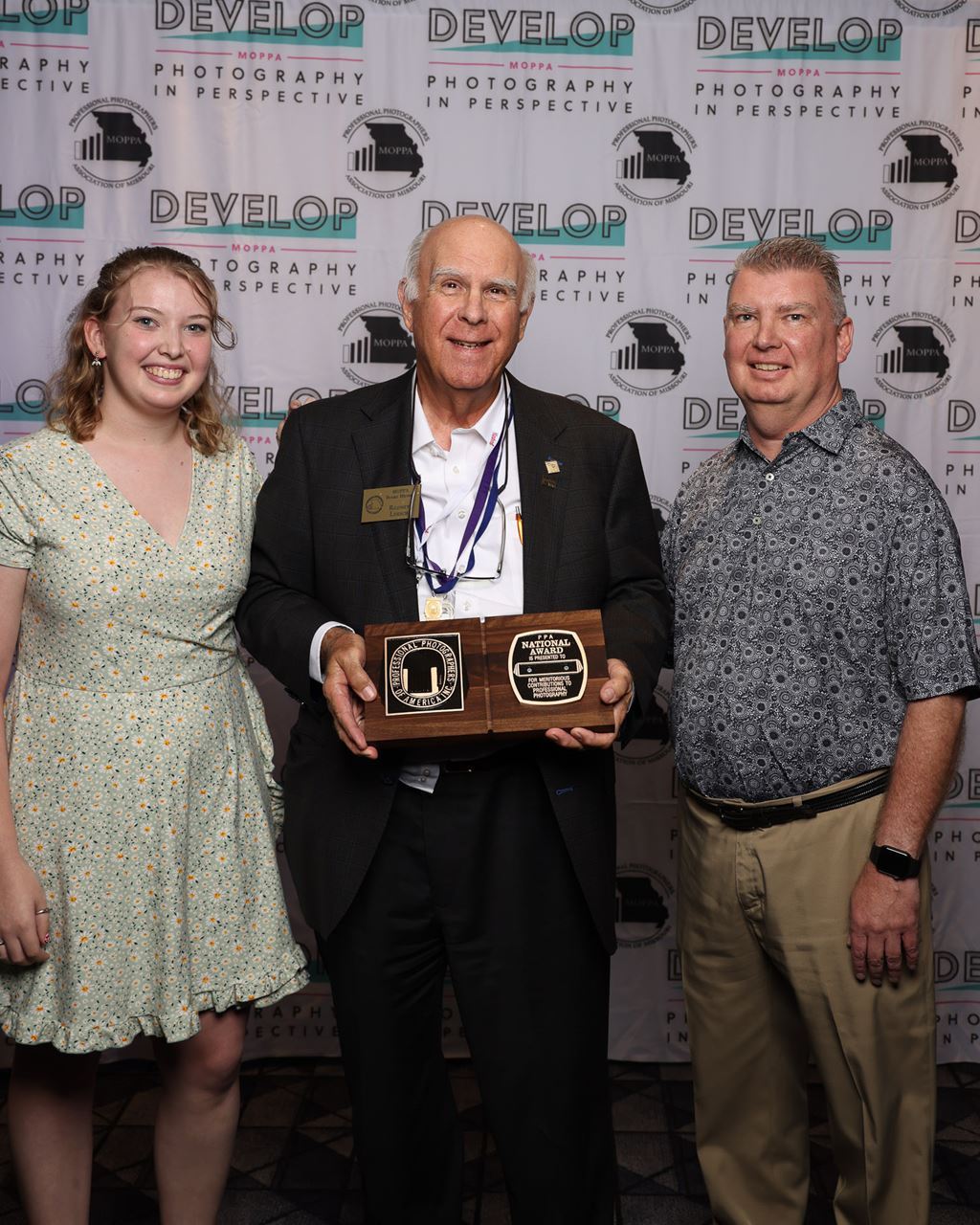 Rodney Loesch receives the National Award at the Missouri Professional Photographer Conference