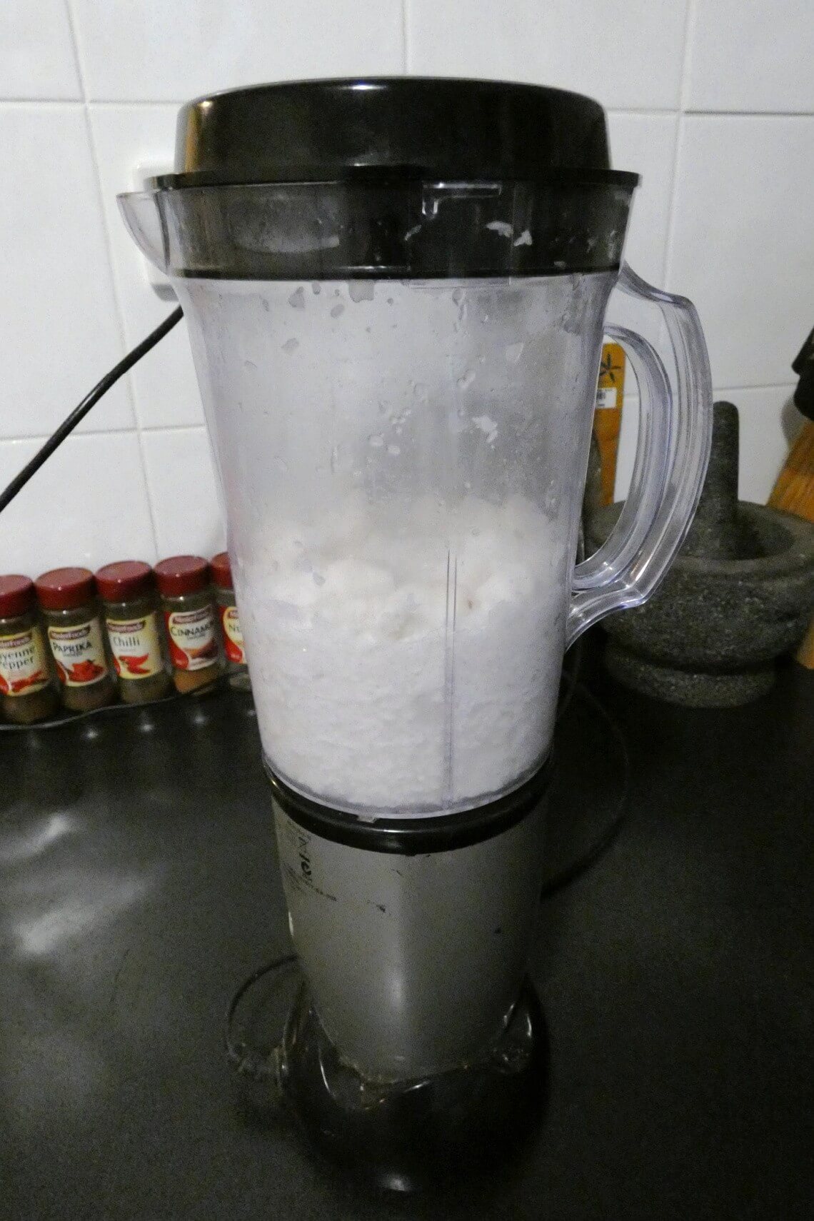 A blender full of coconut milk from fresh coconut A blender full of coconut milk from fresh coconut