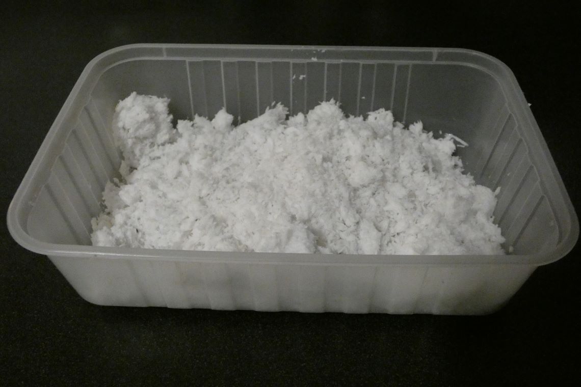 Coconut meal in a container Coconut meal in a container