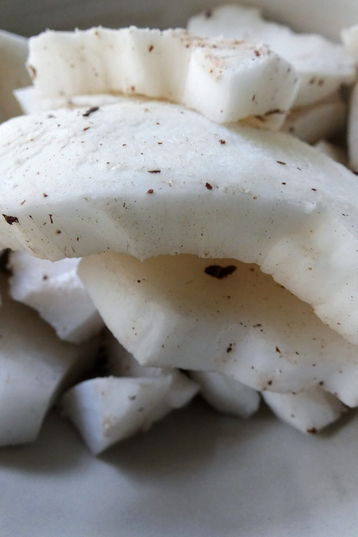 A pile of freshly cracked coconut meat pieces A pile of freshly cracked coconut meat pieces