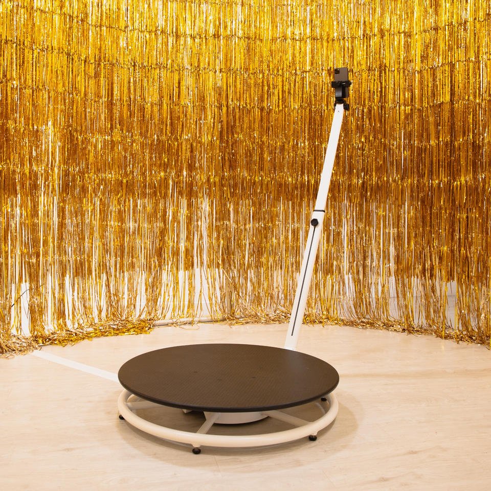 Premium 360 photo booth setup with gold backdrop