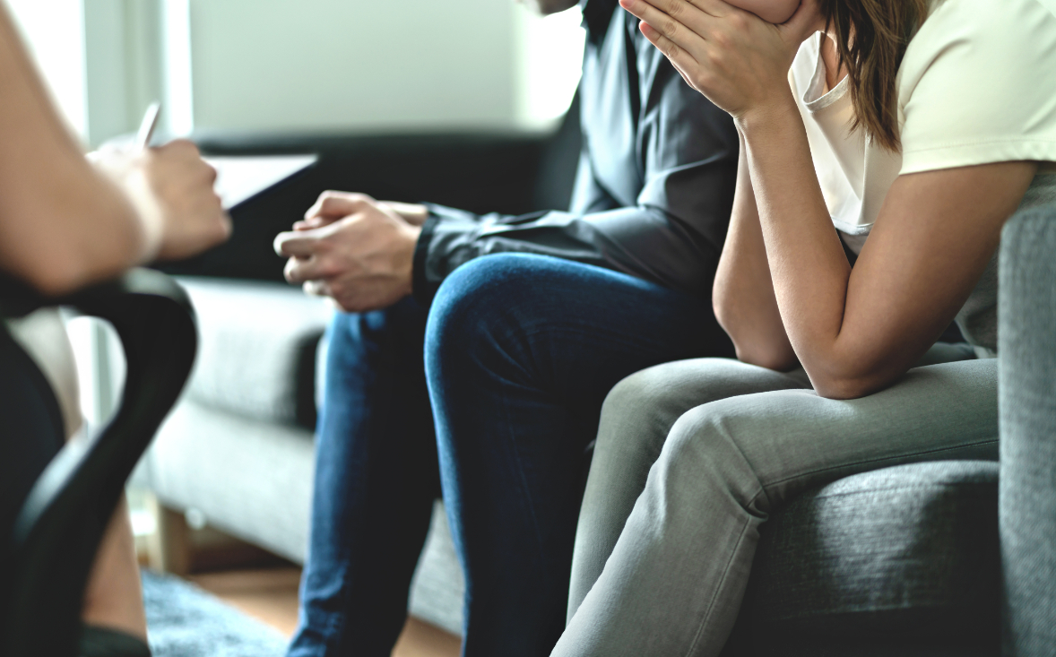 Couple on a couch during marriage counseling 