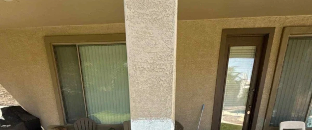 Exterior patio column partially painted during home painting preparation Exterior patio column partially painted during home painting preparation