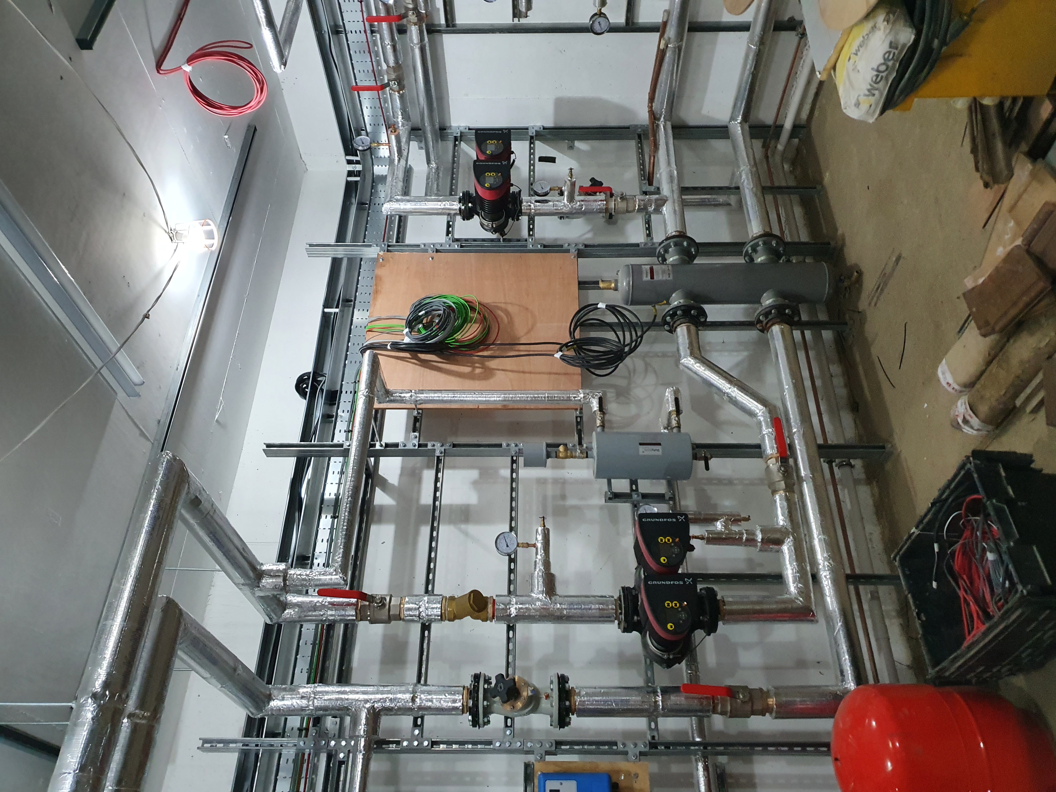 Steyning BN44 — heritage plantroom installation with heat pumps, oil boilers, and Joule cylinders by Sable Projects.