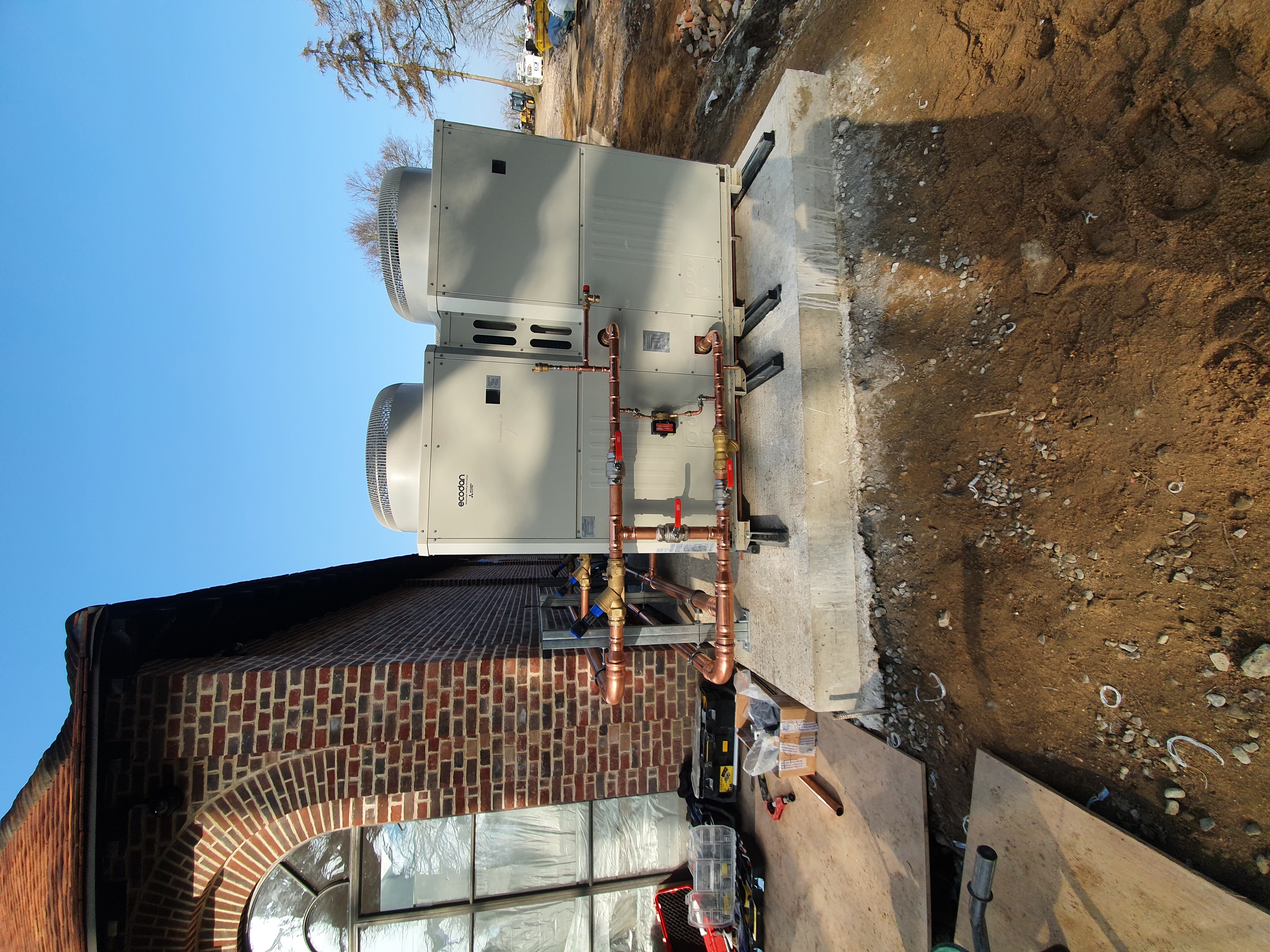 Three ASHPs + two oil-fired commercial boilers for hybrid heating