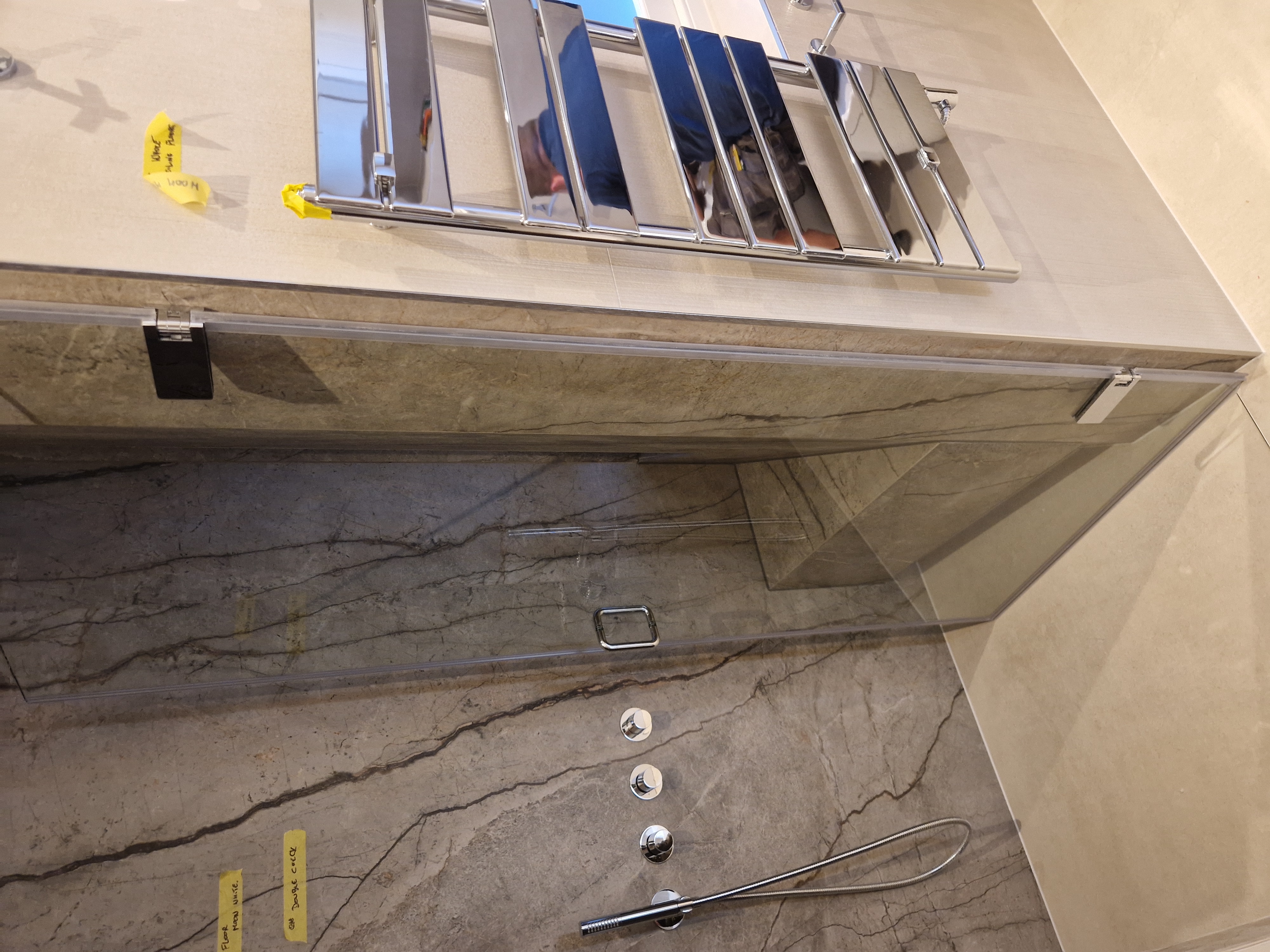 Iverna Gardens W8 — finished luxury bathroom installation with concealed pipework.