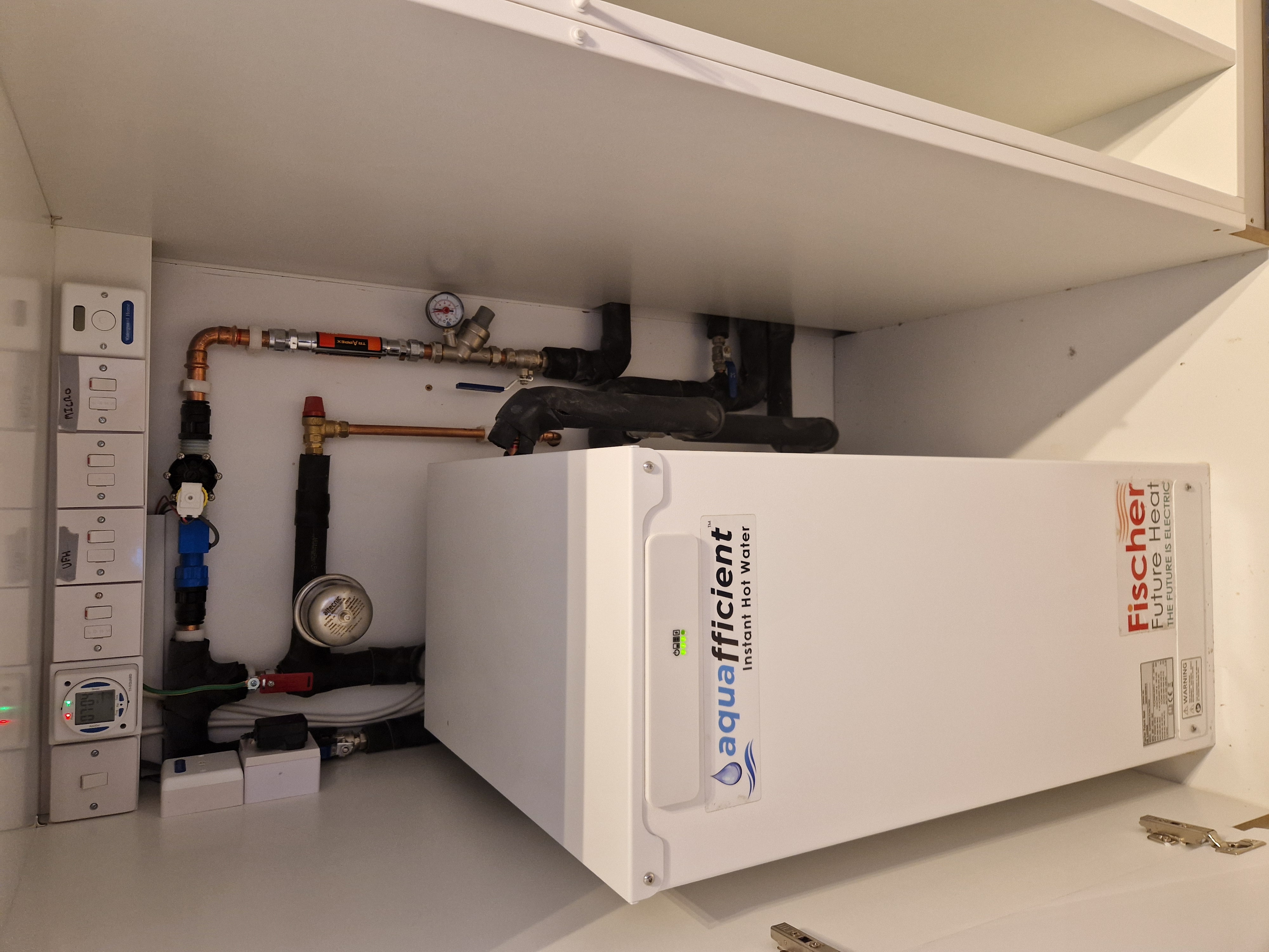 Iverna Gardens W8 — Fischer Aquafficient electric boiler installation with Mapress copper pipework.