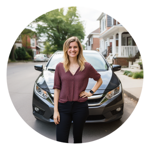 A photo of a happy customer standing in front of her new Honda Civic car, smiling in excitement