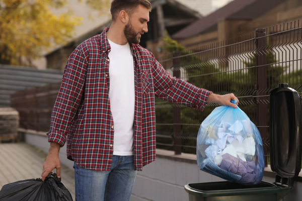 Man putting bins out act of service