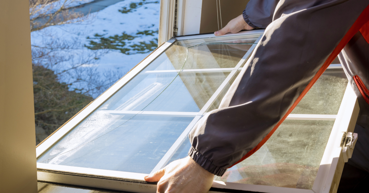 man holding a crack window man holding a crack window
