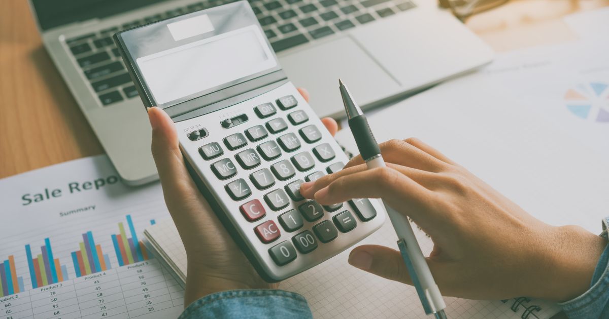 man using calculator and pen man using calculator and pen