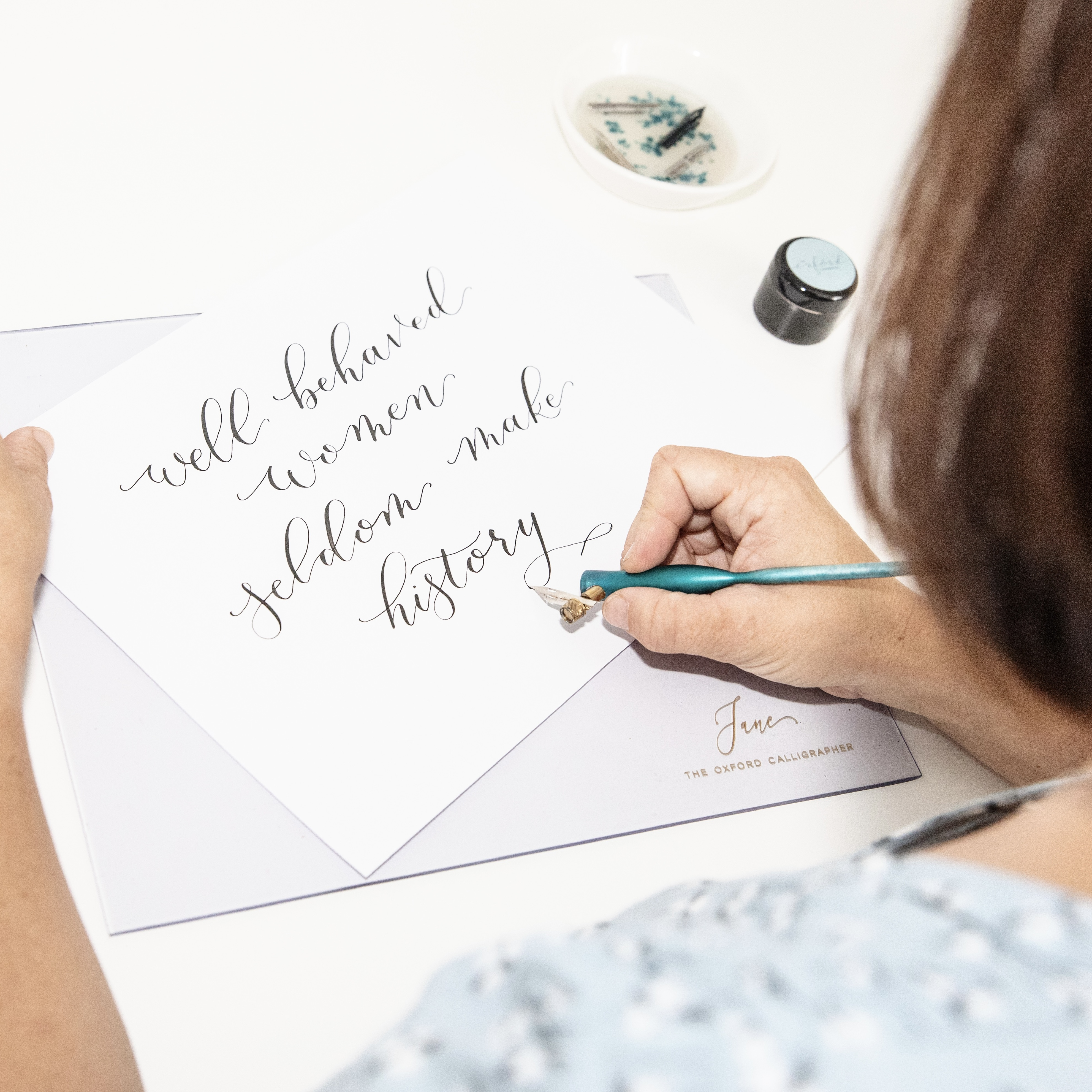 The Oxford Calligrapher writing calligraphy