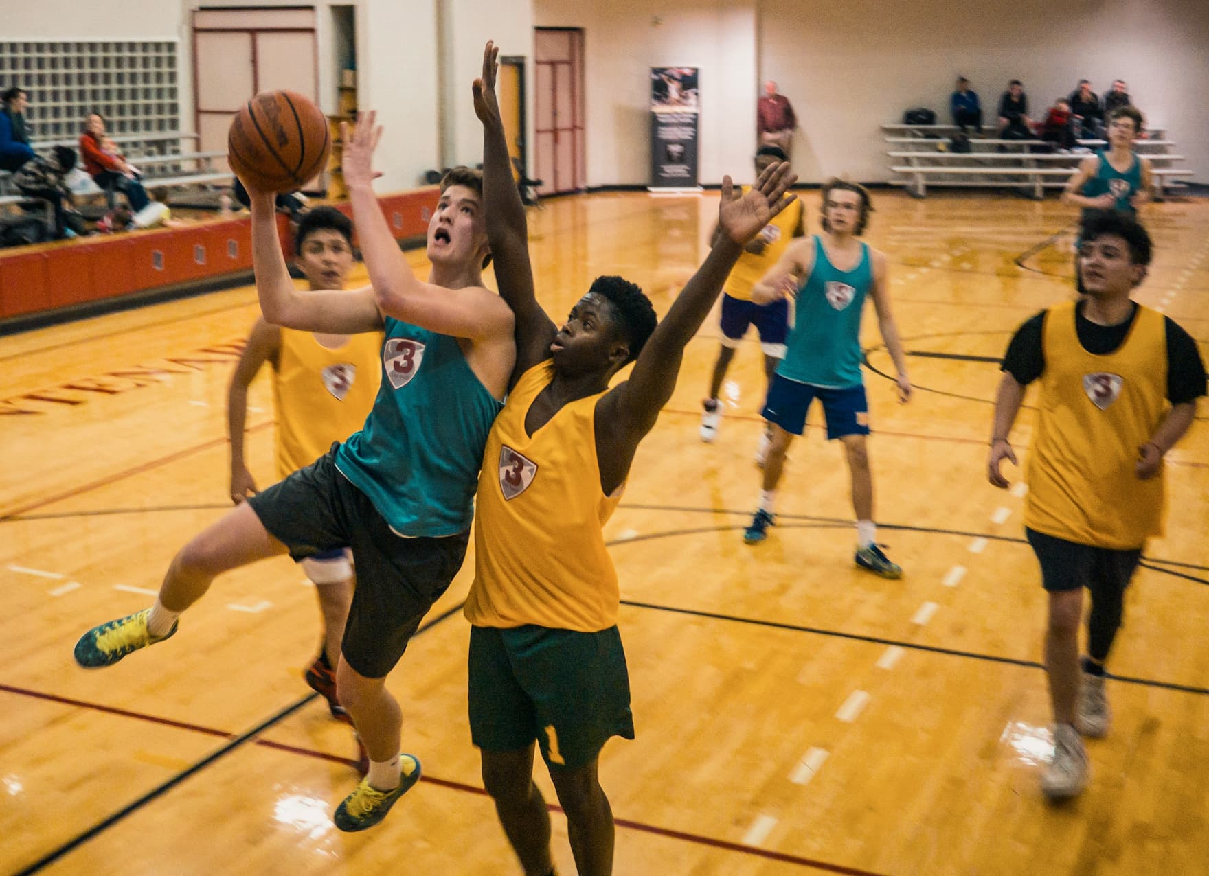 Boy shooting a close range basketball shot