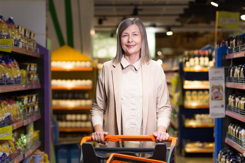 Happy senior couple smiling together on couch