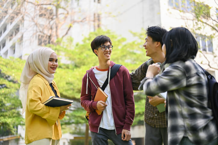 A student in TOEFL prep classes talking to classmates