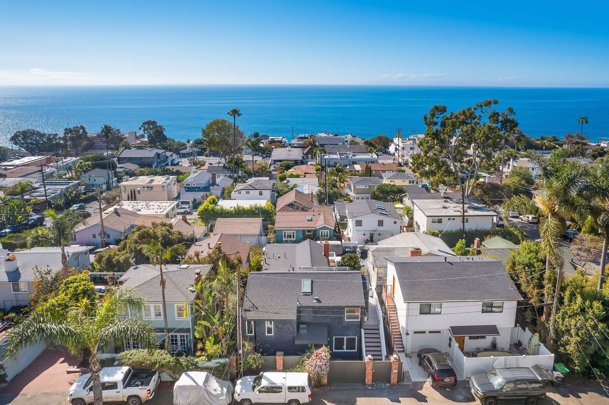 Laguna Beach aerial view of homes with the ocean in the background. Laguna Beach aerial view of homes with the ocean in the background.