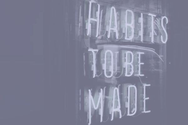 neon sign saying habits to be made