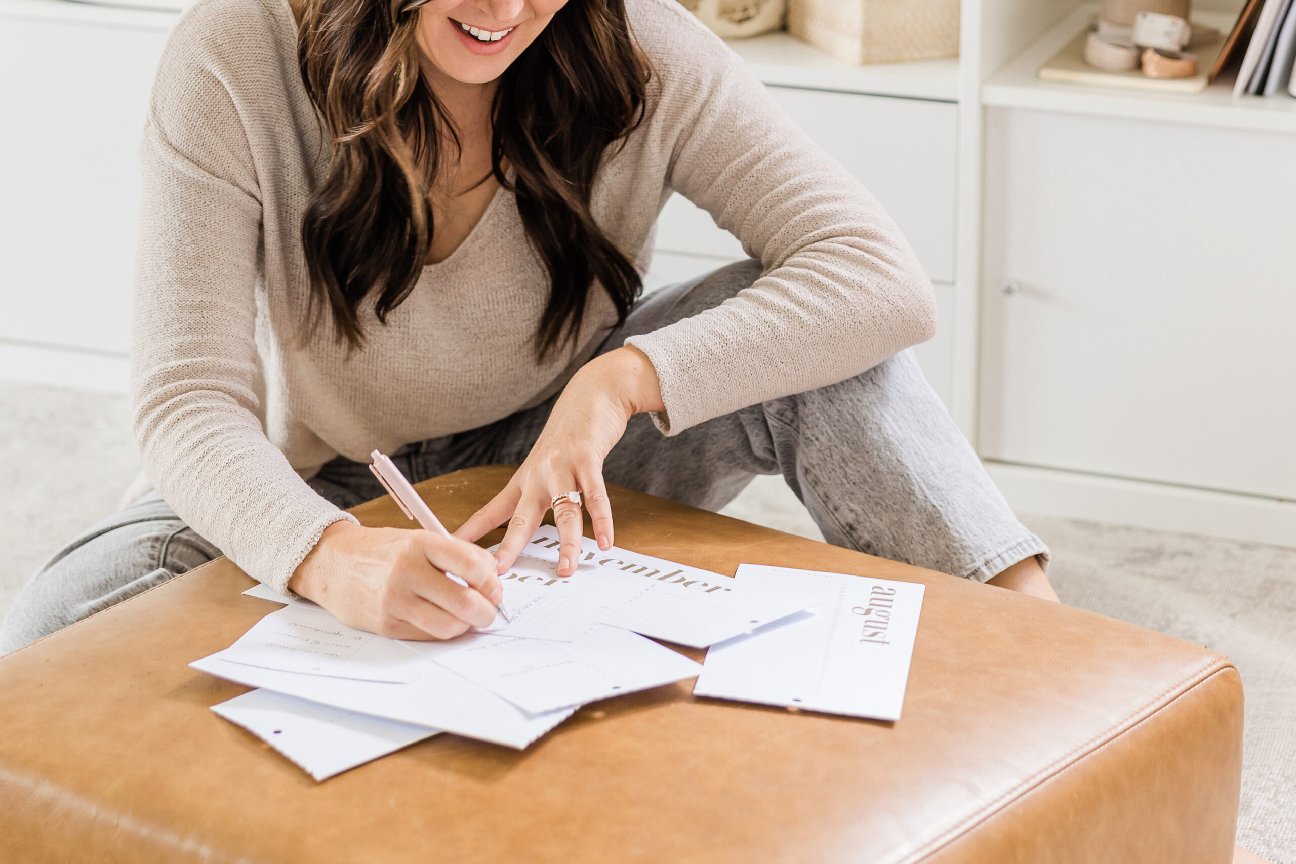Woman writing down goals Woman writing down goals