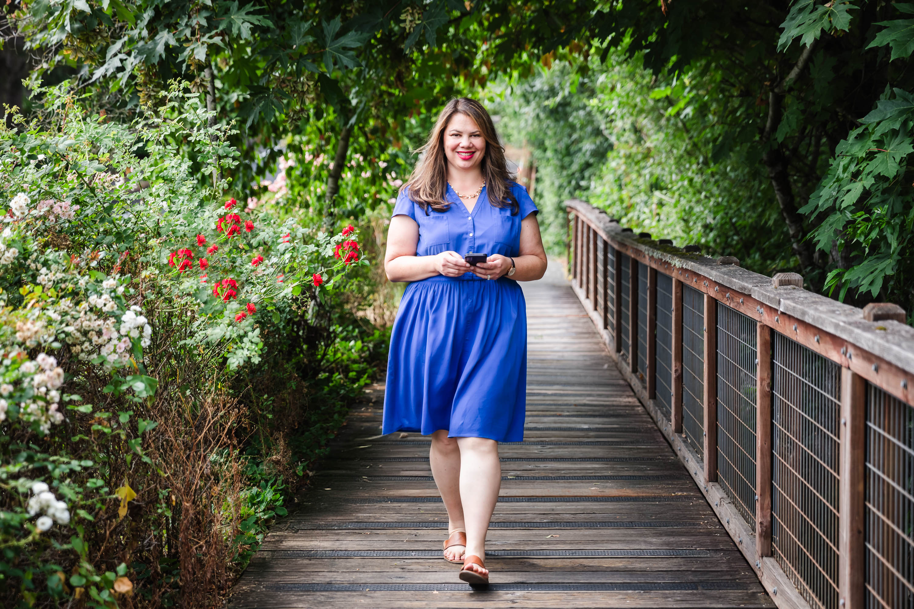 businesswoman smiling outdoors during branding shoot businesswoman smiling outdoors during branding shoot
