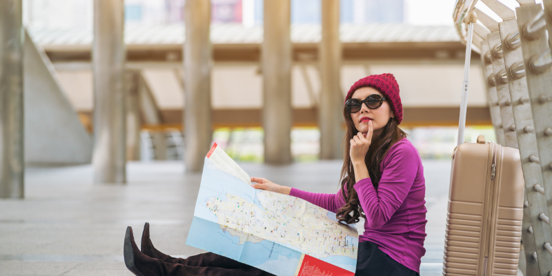 traveler looking at a map traveler looking at a map