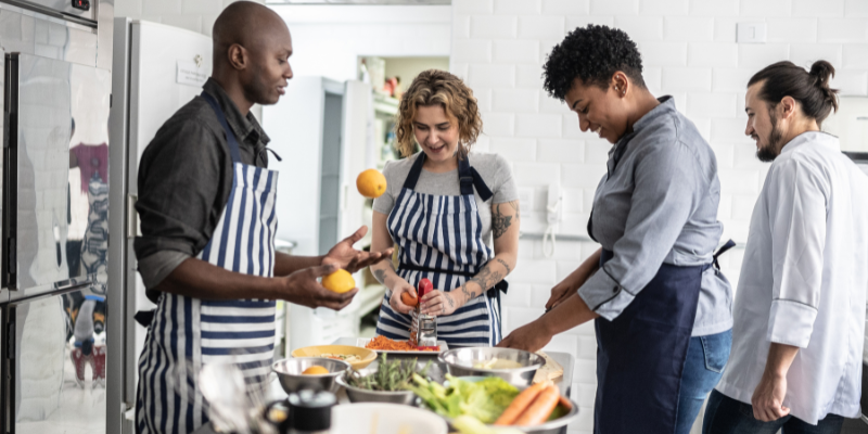 solo traveler making friends at a cooking class solo traveler making friends at a cooking class