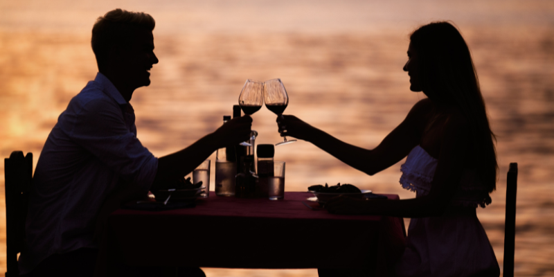couple enjoying a candlelit dinner on the beach couple enjoying a candlelit dinner on the beach