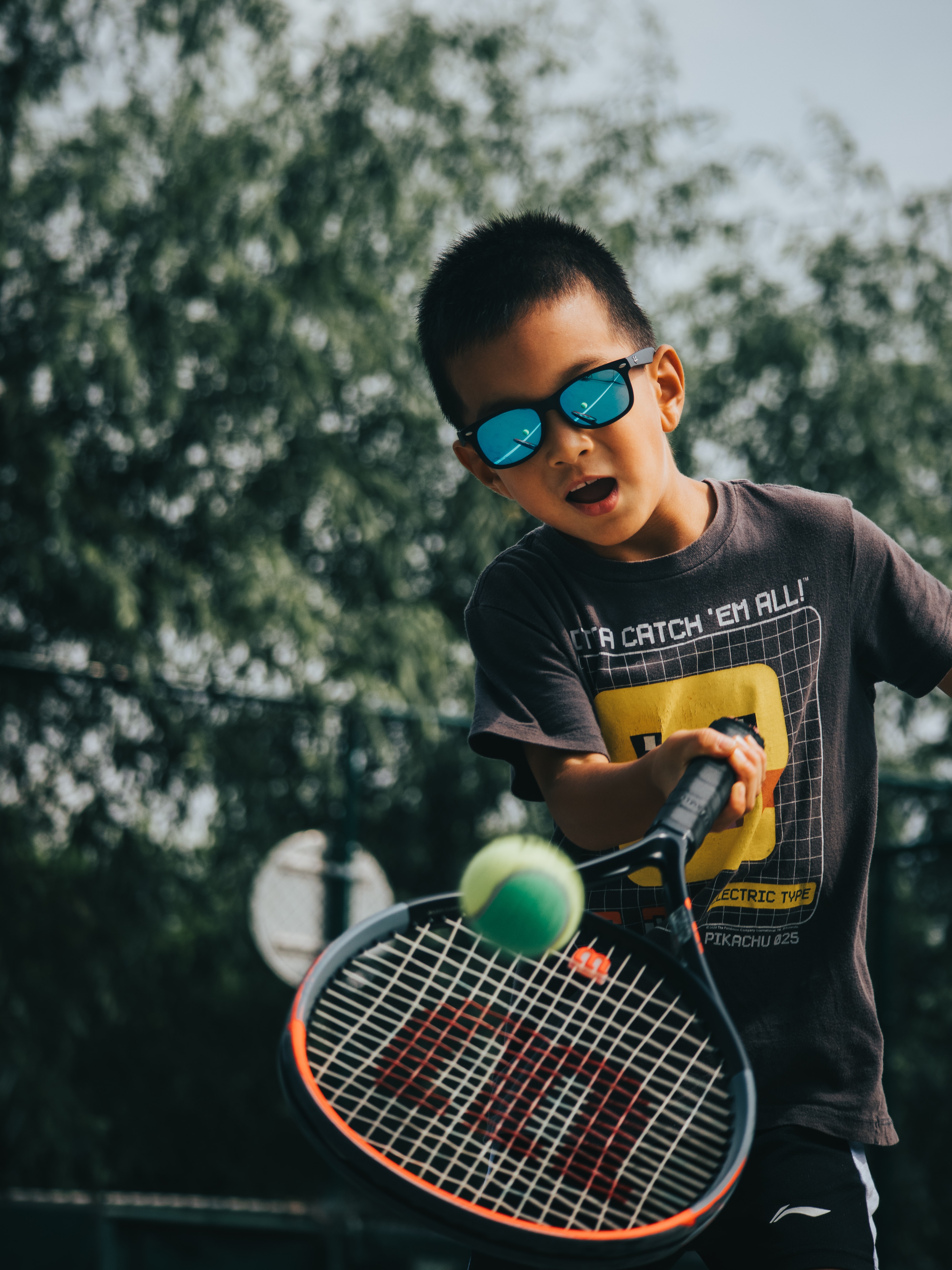 kit playing tennis at the best summer camp for tennis in lower manhattan.