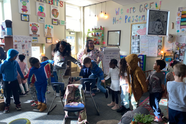 Annie leads her kindergarten and first grade crew through a team-building activity during morning meeting