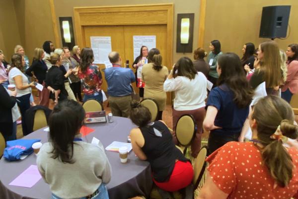 Teachers gather around to learn about play at the EL National Conference in Denver