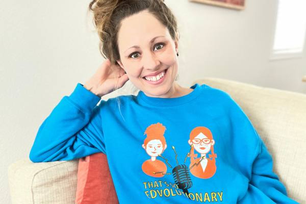 a photo of Ali wearing her That's SO EDVOLUTIONARY Podcast sweatshirt