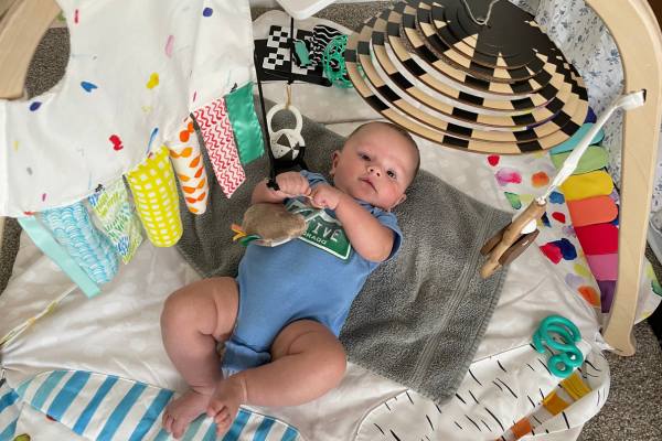 Baby playing at a Loveevery play gym