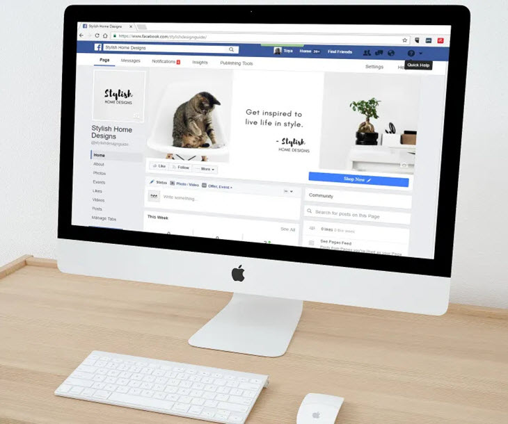 Person looking at their Facebook page on a computer monitor, emphasizing social media engagement and online presence.