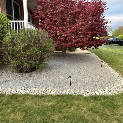 Decorative stone bed with red tree