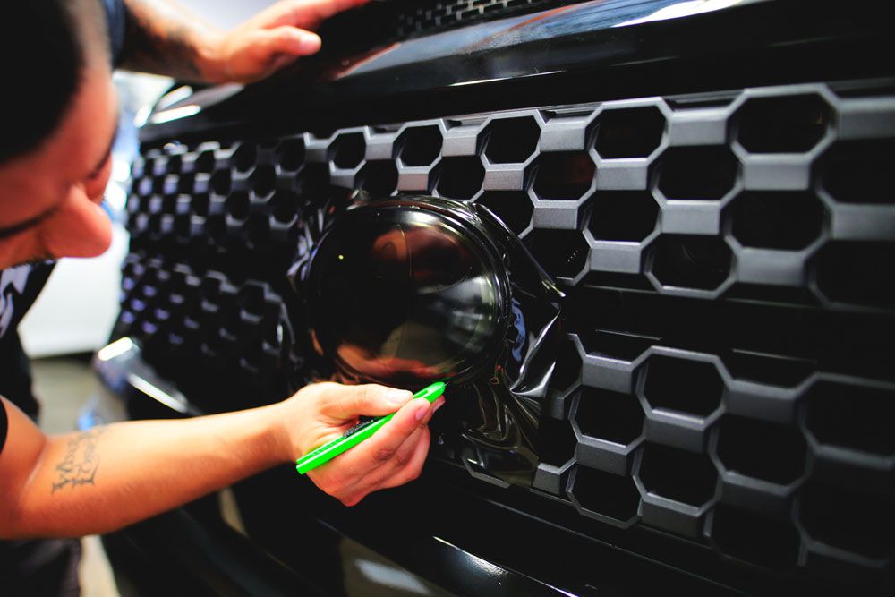 Chrome delete service showing sleek black vinyl applied to chrome trim for modern stealth aesthetic