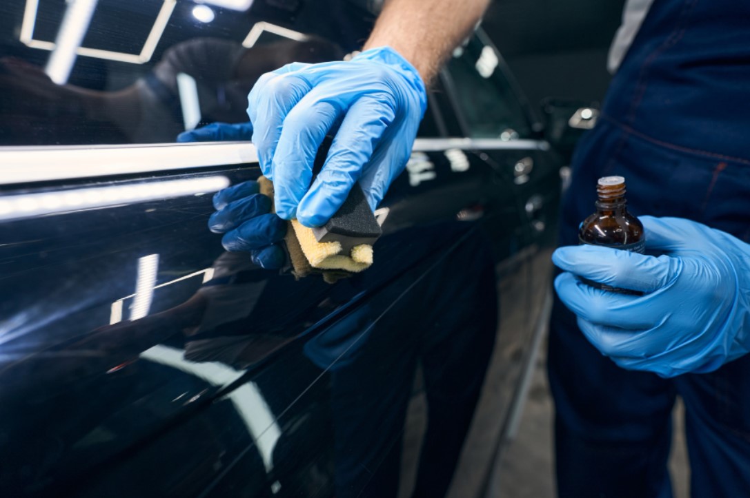 Water beading perfectly on ceramic coated car surface, demonstrating hydrophobic protection and mirror-like gloss finish
