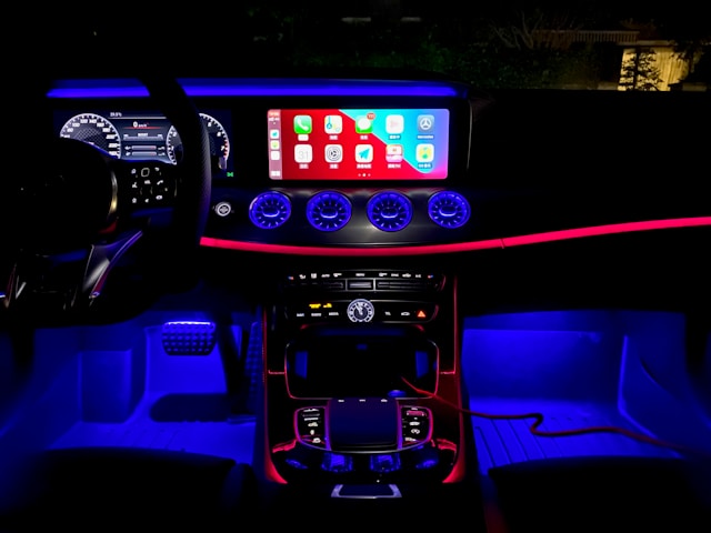 Custom atmospheric lighting with ambient interior and underbody glow effects on a luxury vehicle
