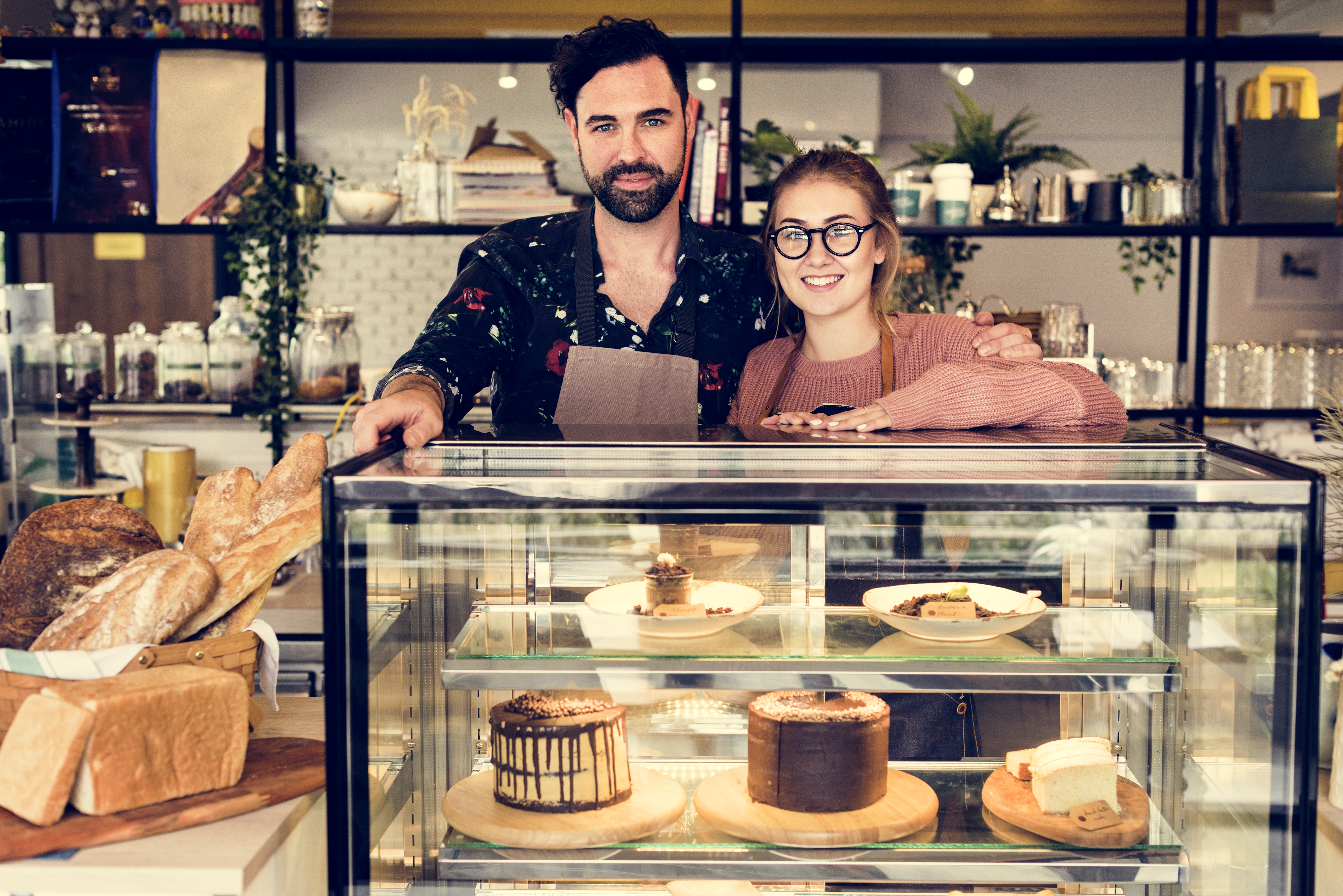 Father and Daughter standing together in family bakery