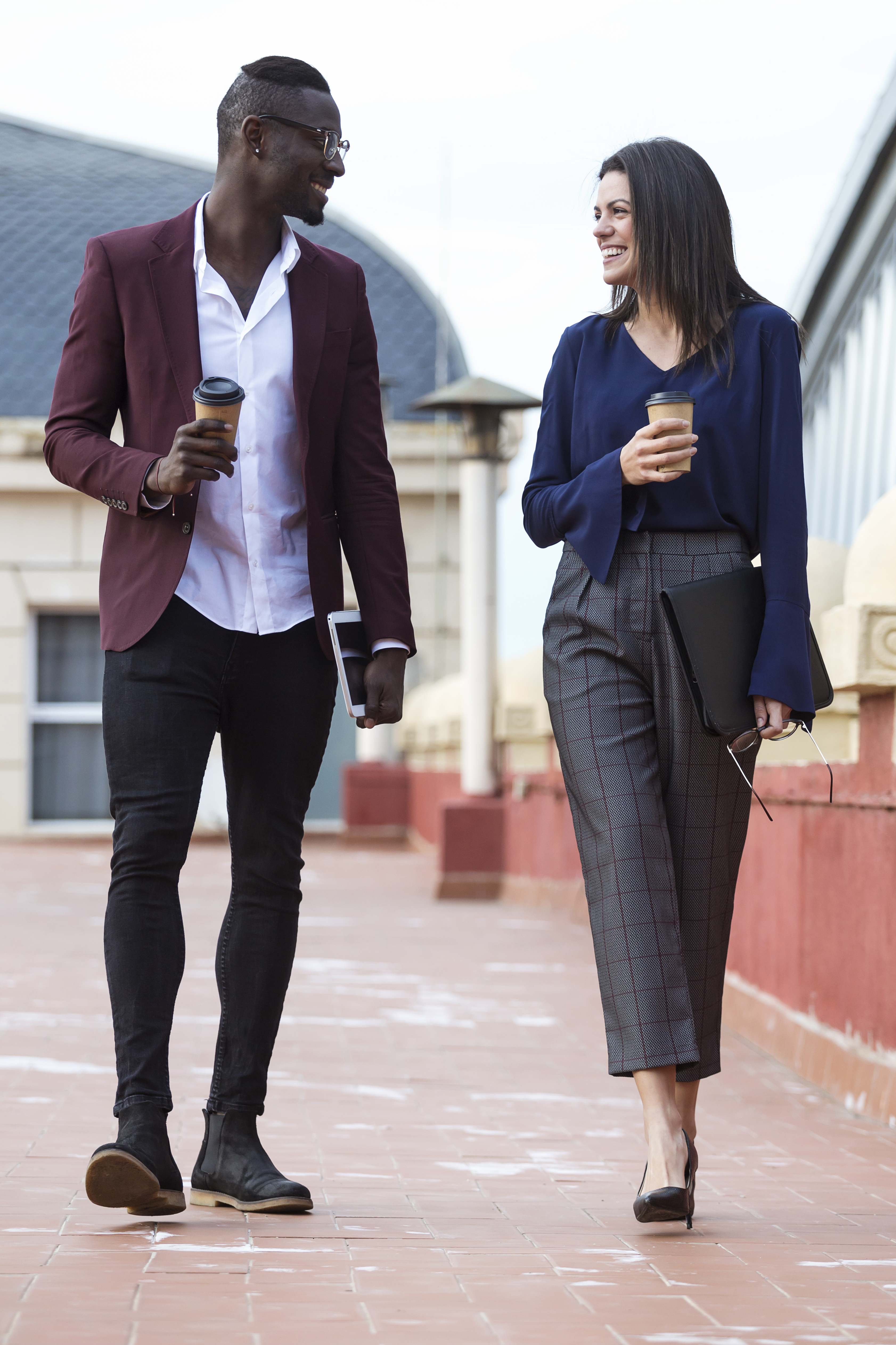 Businessman and woman having a meeting on a hotel terrace on a business trip