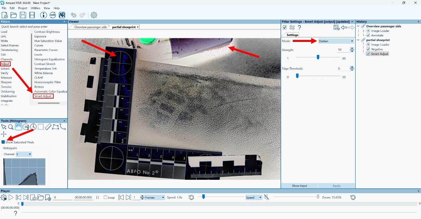Screenshot of Amped FIVE software showing forensic image enhancement of a partial footwear mark on a textured surface. The image is processed using the "Smart Adjust" filter in "Darken" mode to improve contrast. ABFO No. 2 scale is visible in an L-shaped configuration. Saturated pixels are highlighted, and red arrows point to enhanced features and interface elements. Histogram and adjustment settings are shown on the left and right panels, respectively. Screenshot of Amped FIVE software showing forensic image enhancement of a partial footwear mark on a textured surface. The image is processed using the "Smart Adjust" filter in "Darken" mode to improve contrast. ABFO No. 2 scale is visible in an L-shaped configuration. Saturated pixels are highlighted, and red arrows point to enhanced features and interface elements. Histogram and adjustment settings are shown on the left and right panels, respectively.