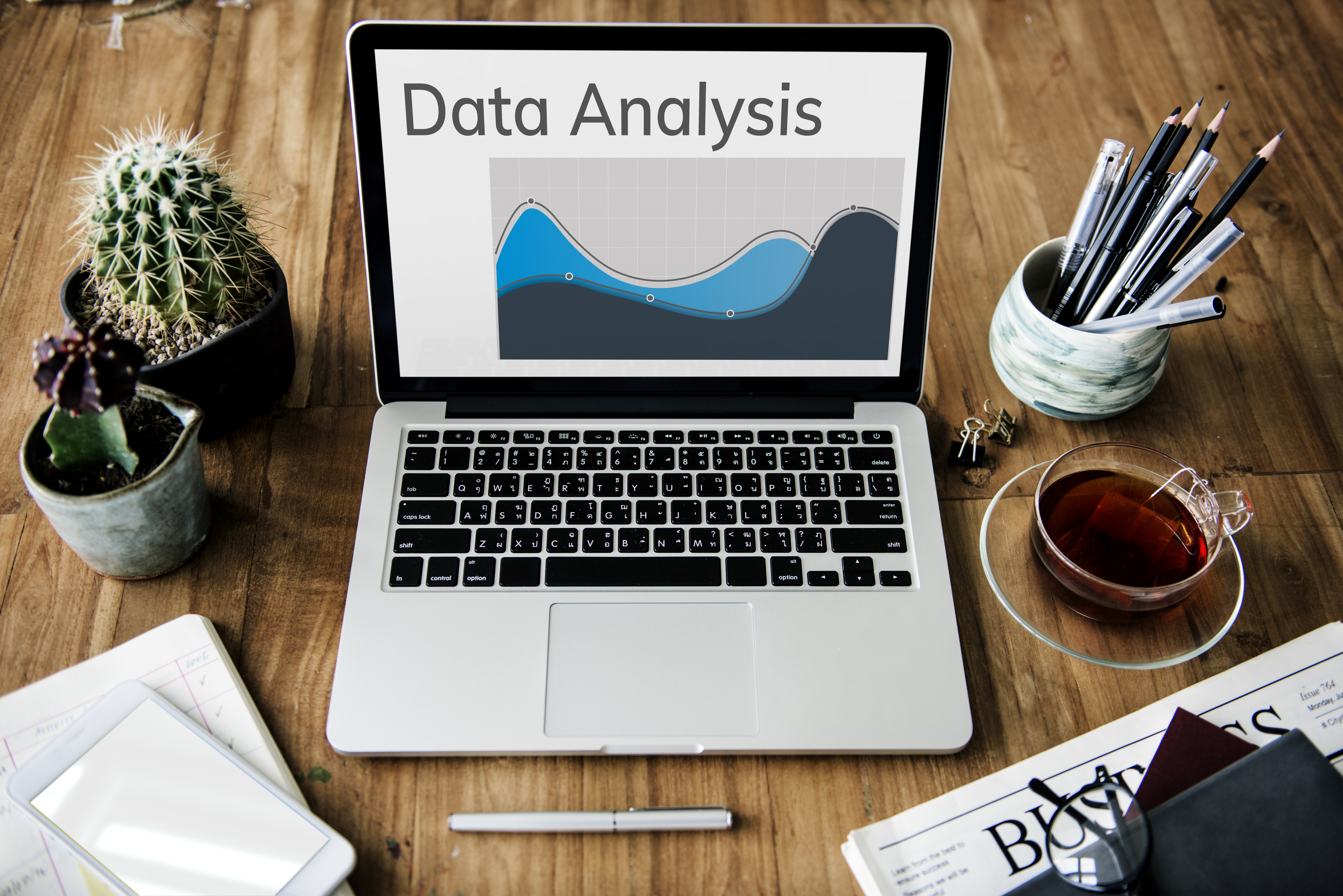 Desk with computer that says data analysis