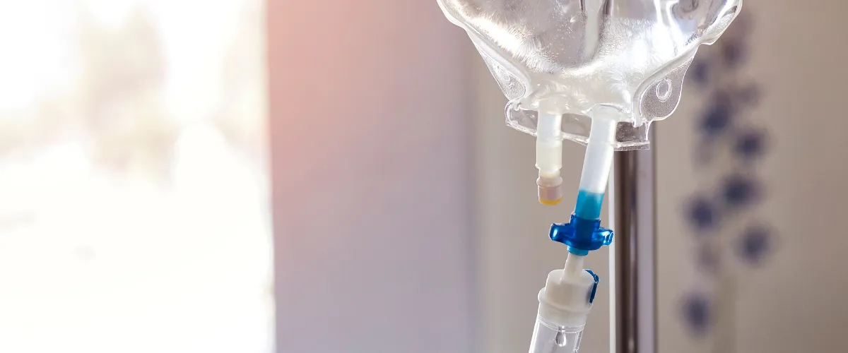 Close-up of IV therapy drip bag for hydration and wellness treatment Close-up of IV therapy drip bag for hydration and wellness treatment