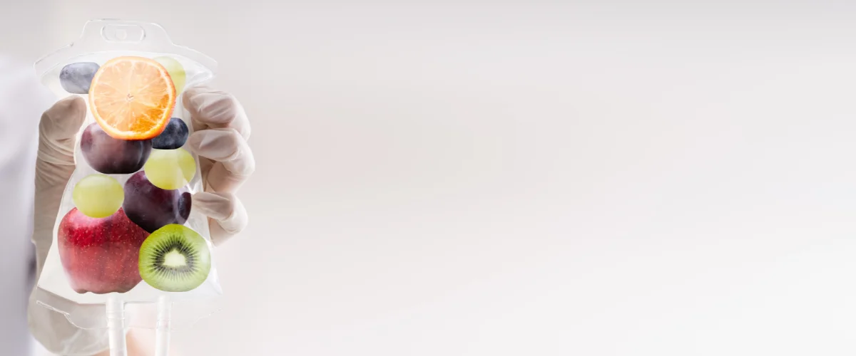 Vitamin infusion IV bag illustrated with fruits representing nutrient therapy