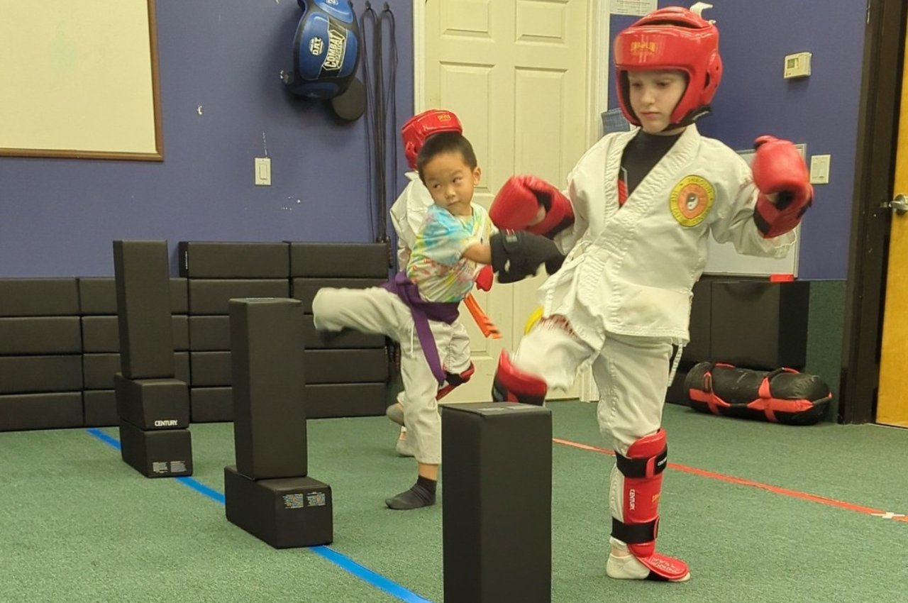 Martial arts instructor with kids