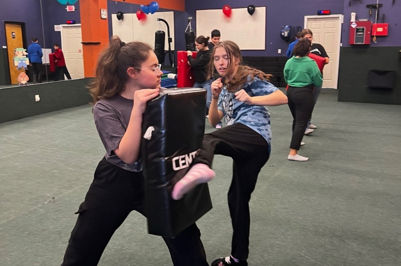 Martial arts instructor with kids