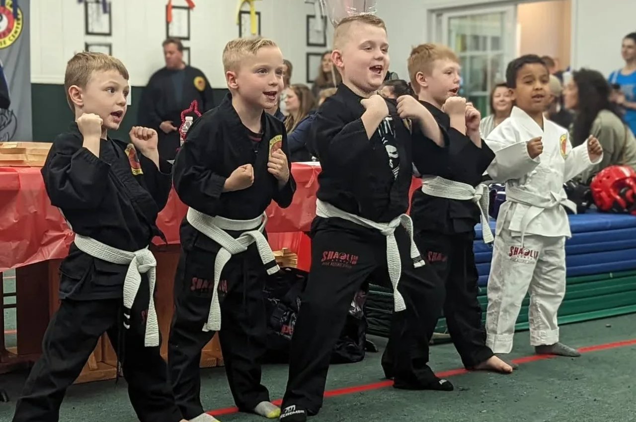 Martial arts instructor with kids